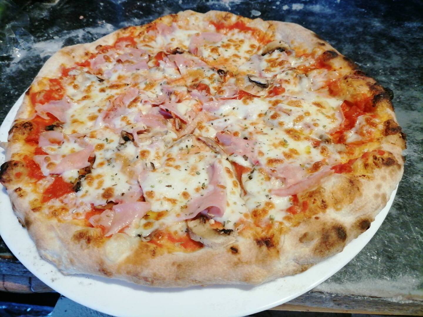 Classic Margherita pizza with fresh basil and mozzarella